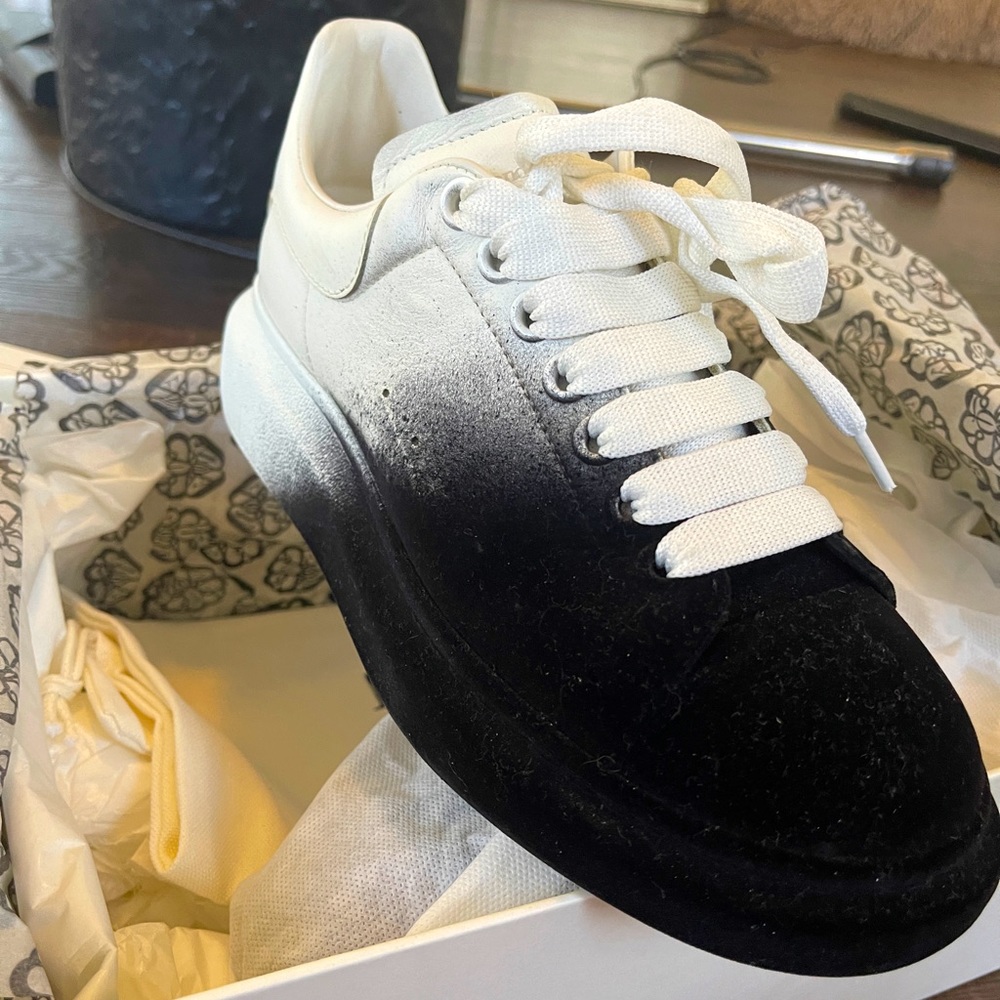 Alexander McQueen calf skin leather and the black is suede.